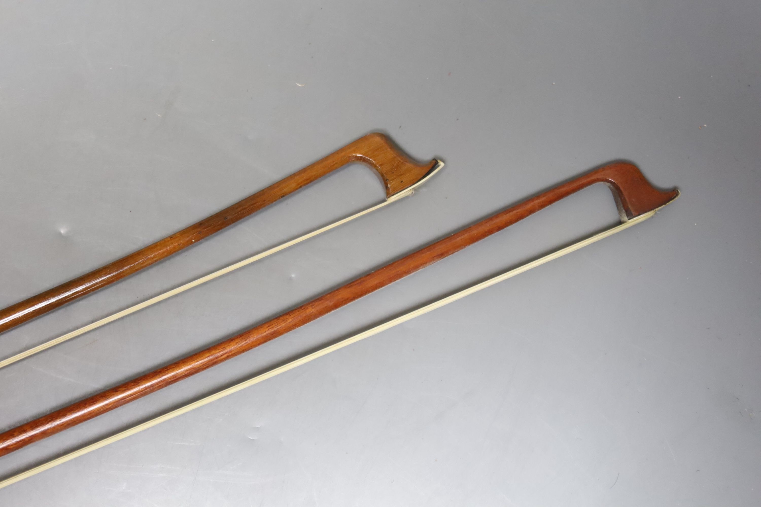 Two cased violin bows, one with tortoiseshell frog, by G.W Wood